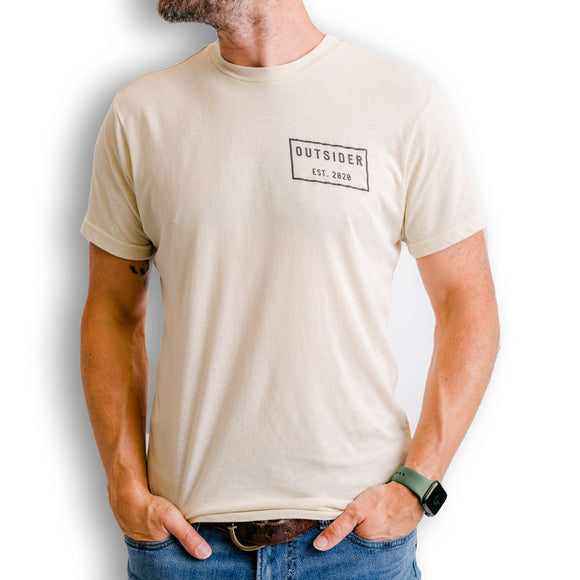 Outsider Tilt Tee Men's Short Sleeve T-shirt in Bone Off White modeled on a man