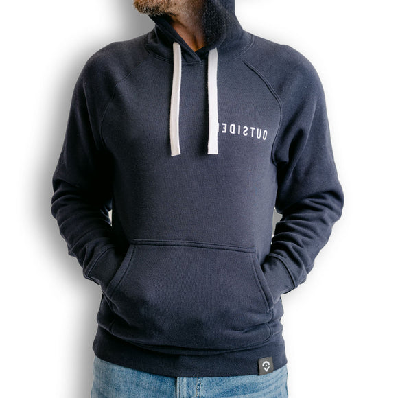 Outsider Unisex Backwards Hoodie Hooded Sweatshirt in Navy Blue with White Logo and Strings modeled on man