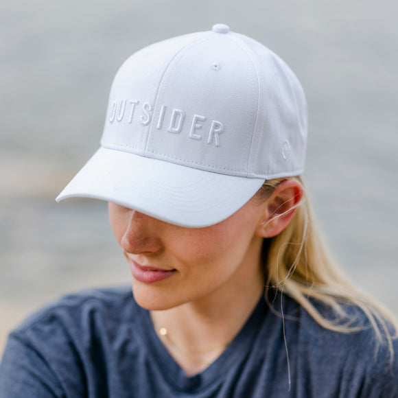 Outsider White on White Monochrome Hat with adjustable snapback modeled on a woman